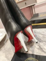 Christian Louboutin Astrilarge Booty 100 black and white leather boots